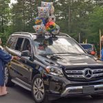 Graduate getting in car