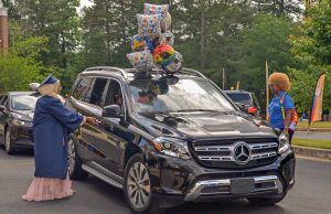 Graduate getting in car