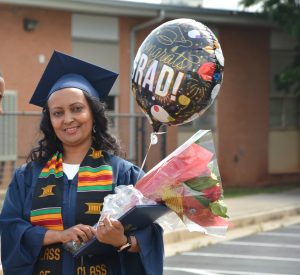 Woman with flowers and balloons