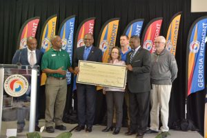 Picture of Representatives of DART Foundation present a donation to the Georgia Piedmont Technical College Foundation to support the development of a lab that meets Industry 4.0 at the college's advanced manufacturing center.