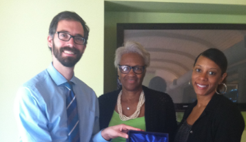 Johannes Kliner, Director of Emory University's SHINE, presents award to Judieth Williamson, Georgia Piedmont ESL night teacher, and Melanie Armstrong, Georgia Piedmont ESL night supervisor.