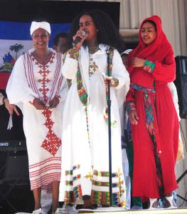 Left to right: Tirhas Woldegiorgis, Mahider Weldehawnriat, Etsubdink Miliket perform at Georgia Piedmont Tech's ESL talent show.