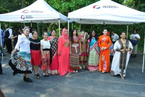 Women from multiple countries in native clothing at Georgia Piedmont Tech's ESL student international talent show.