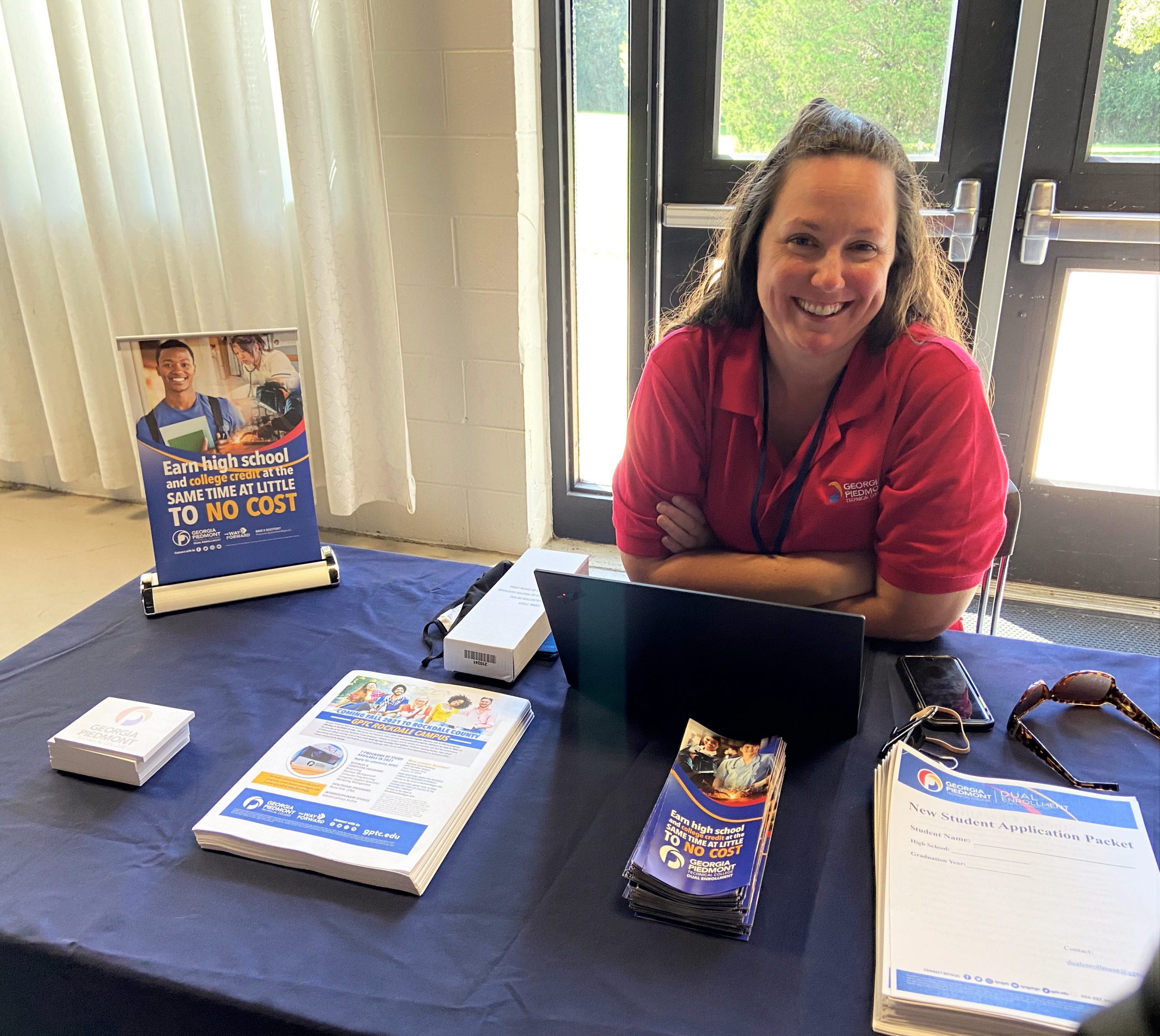 Dual Enrollment display table with director Kristin Corkhill.