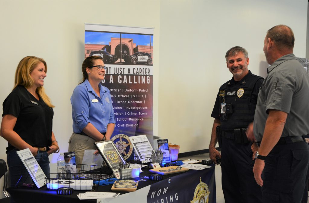 Sheriff's department booth with attendees