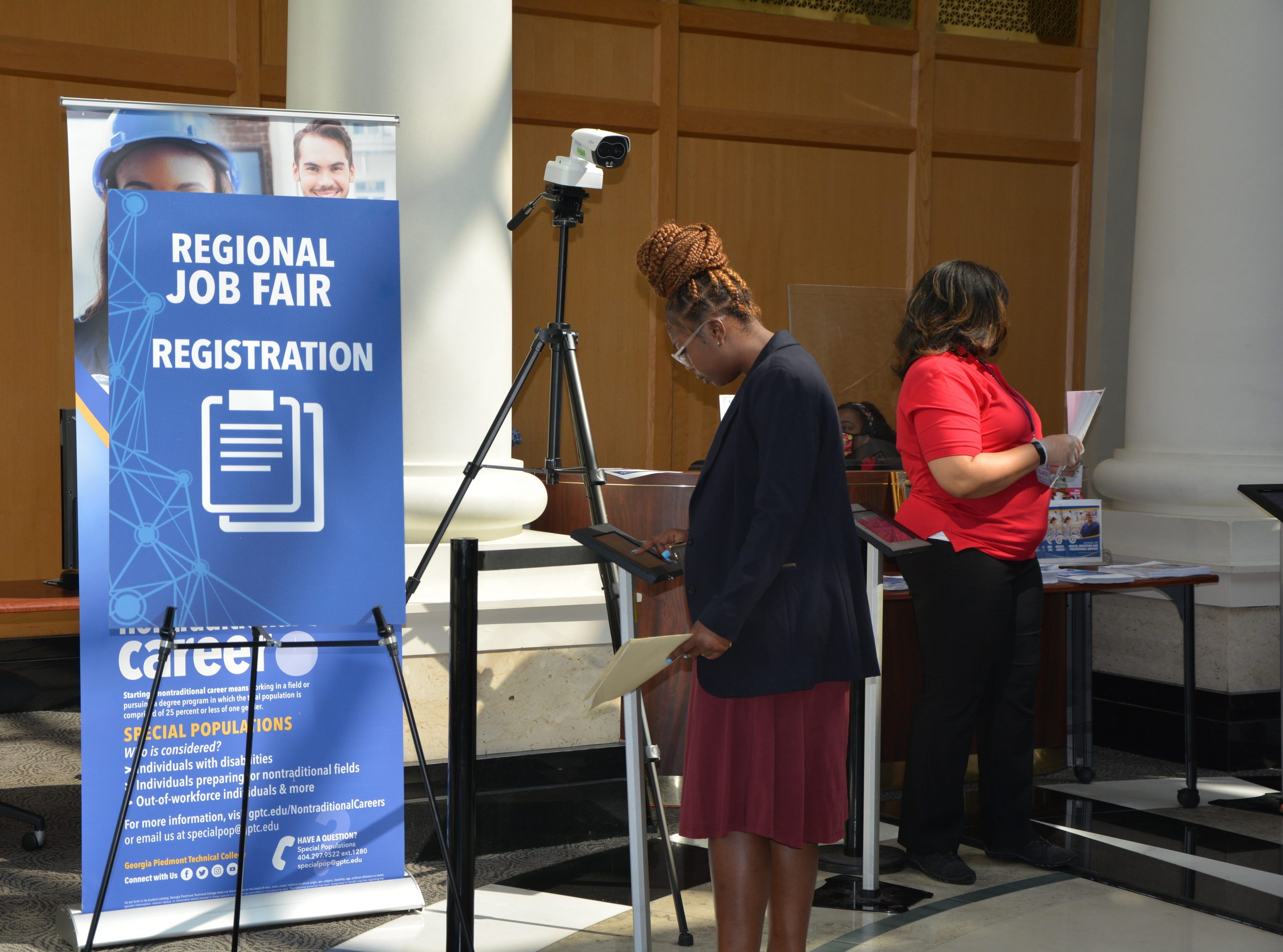 Woman registering via iPad