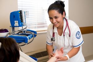 practical nursing student smiling at patient