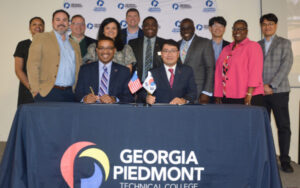 Group of participants posing at signing ceremony
