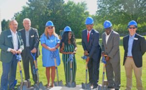 Dignitaries pose with their shovels before the ceremonial groundbreaking.