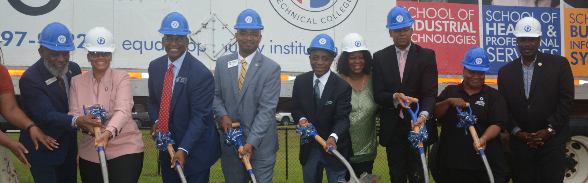 Dignitaries and shovels