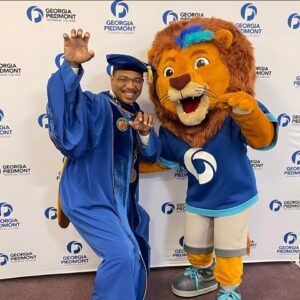 President Tavarez Holston and Monty the Lion